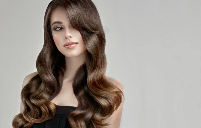 Woman with long wavy brown hair