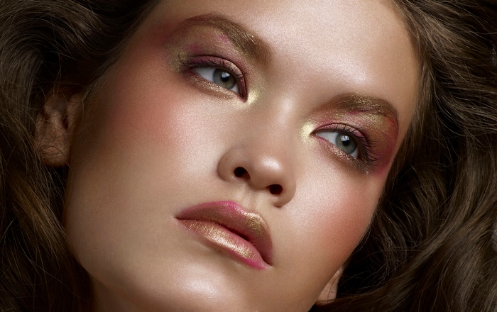 Woman with colorful makeup and green eyes