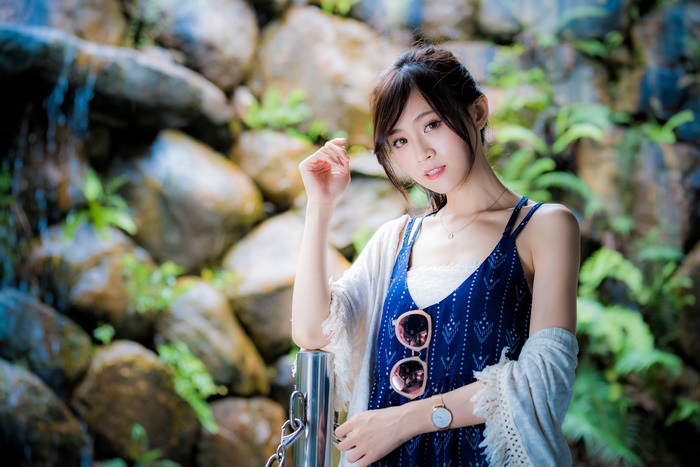 Young Asian Woman in Blue Dress with Sunglasses