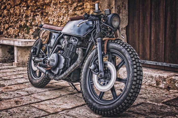 Custom Yamaha Motorcycle parked on stone patio