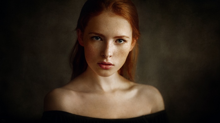 Woman with red hair and freckles