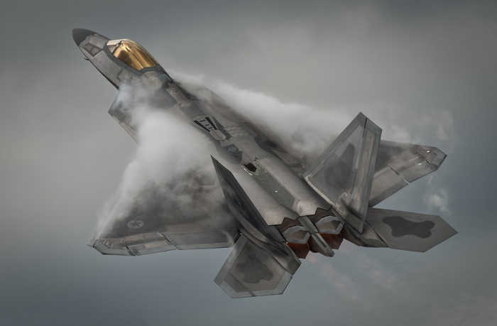 Lockheed Martin F-22 Raptor jet fighter in clouds