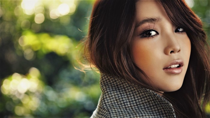 Woman with brown hair and coat