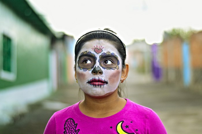 Girl with Sugar Skull Face Paint in Mexico