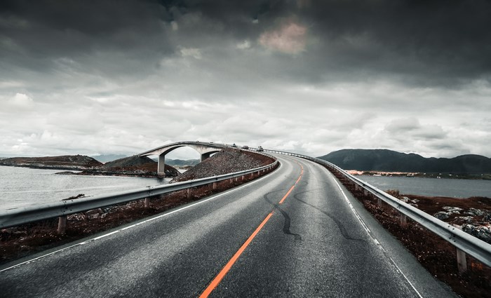 Road curving over a bridge in Norway
