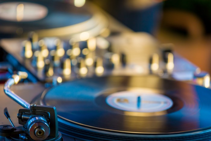 Close-up of a DJ turntable with vinyl record