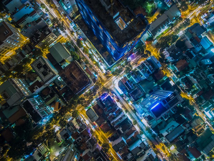 Aerial view of a busy city intersection at night