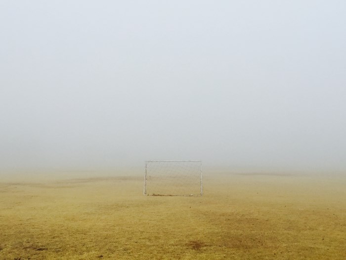 Soccer goal on a foggy field