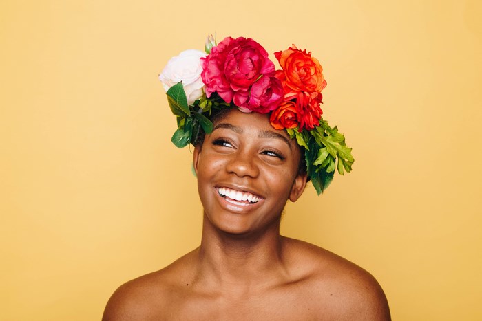 Smiling African American woman with flower crown