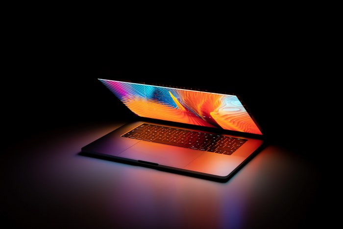 MacBook Pro with colorful abstract wallpaper