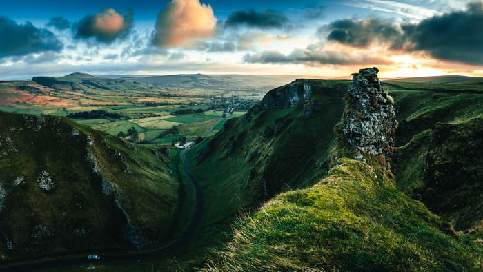 Sunrise over a valley in Peak District, England