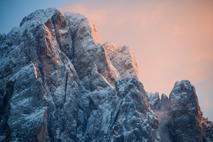 Snow-covered mountain peaks at sunset
