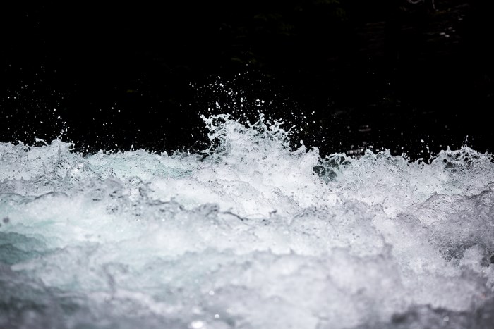 Close-up of water splashing against a dark background