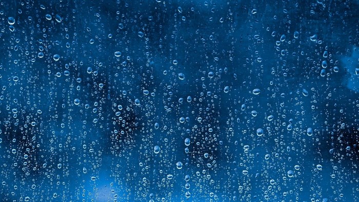 Raindrops on a blue surface