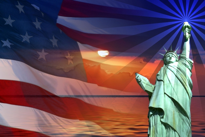 Statue of Liberty and American Flag at Sunset