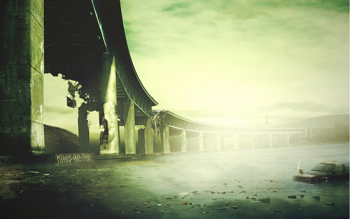 Broken bridge over water with submerged car