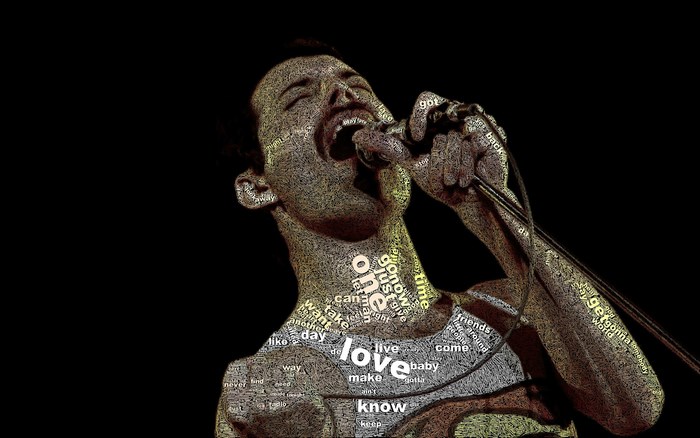 Freddie Mercury singing into a microphone