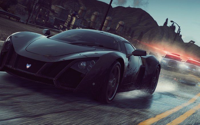 Black supercar pursued by police cars in Need for Speed Most Wanted