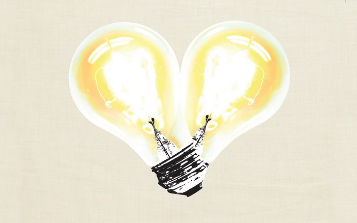 Two light bulbs forming a heart shape