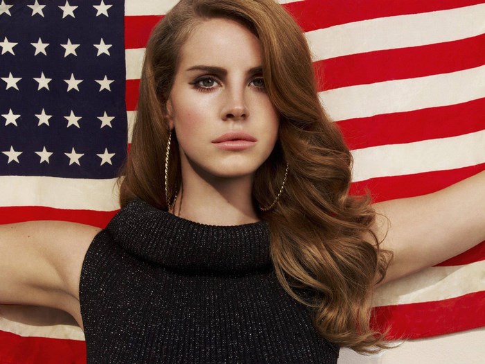 Lana Del Rey in front of American flag