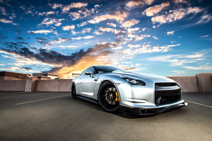 Silver Nissan GT-R parked on rooftop parking lot