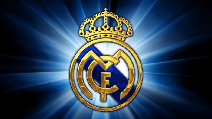Golden Real Madrid Crest with Radiant Blue Light