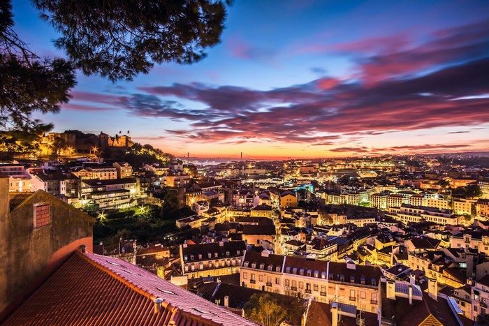 Lisbon cityscape at sunset with castle
