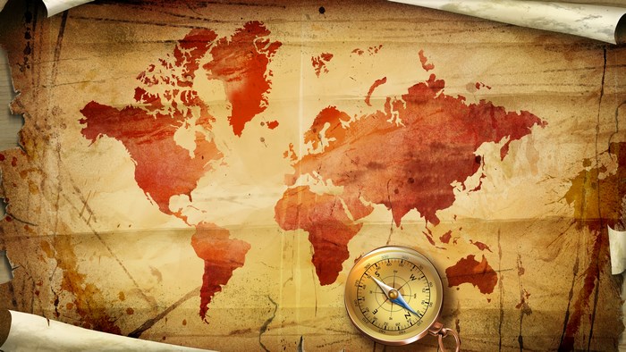 World map with compass on vintage paper