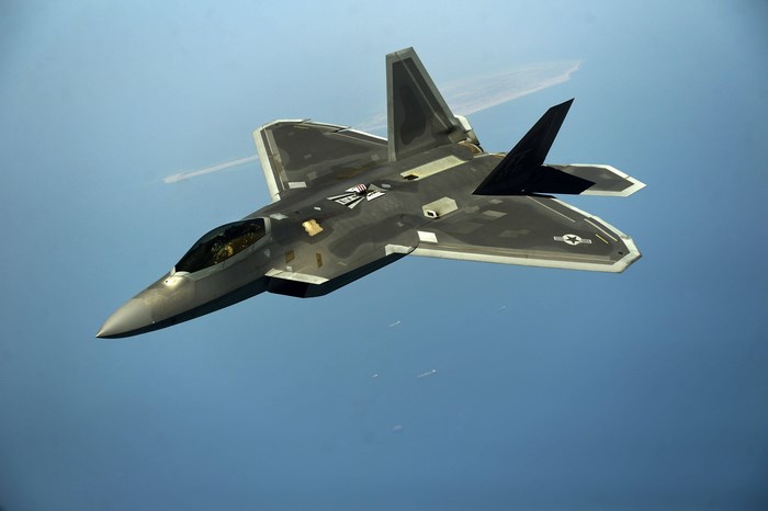 Lockheed Martin F-22 Raptor in flight over water
