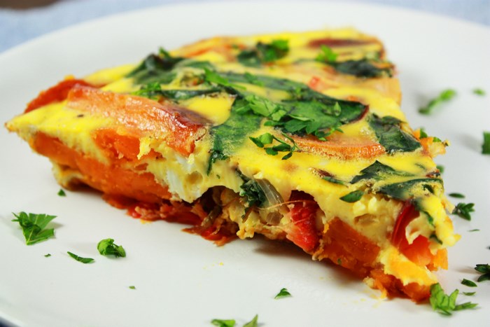 Slice of frittata with sweet potato and spinach