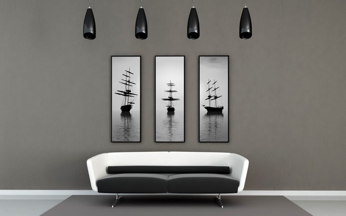 Modern living room with black and white sailboat art