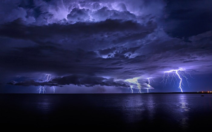 Stormy Night with Lightning over Calm Water