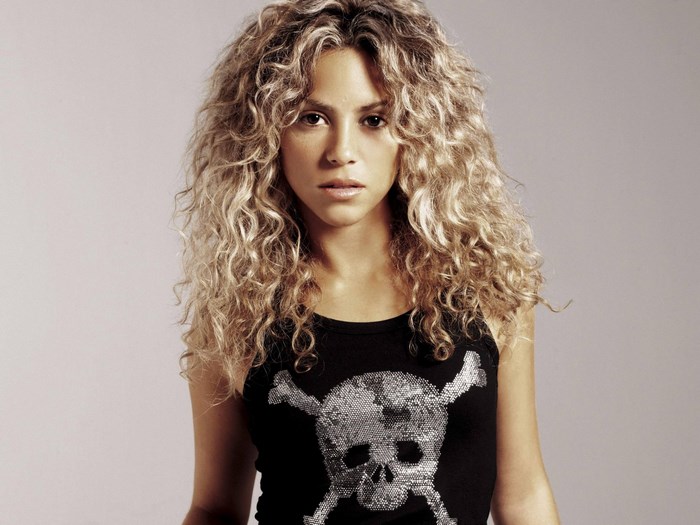 Shakira with a skull and crossbones shirt