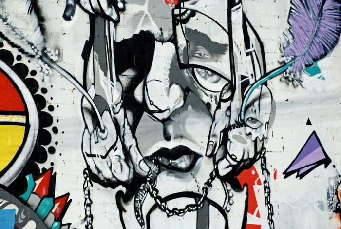 Graffiti art of a face with chains