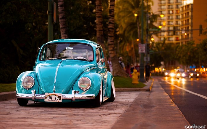 Turquoise Volkswagen Beetle on a Street