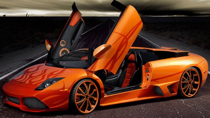 Orange Lamborghini with flame decals and scissor doors