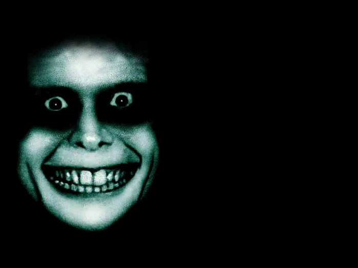 Creepy Smiling Face in Dark Shadows