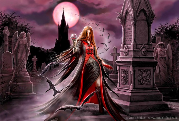 Vampire woman in a graveyard with bats