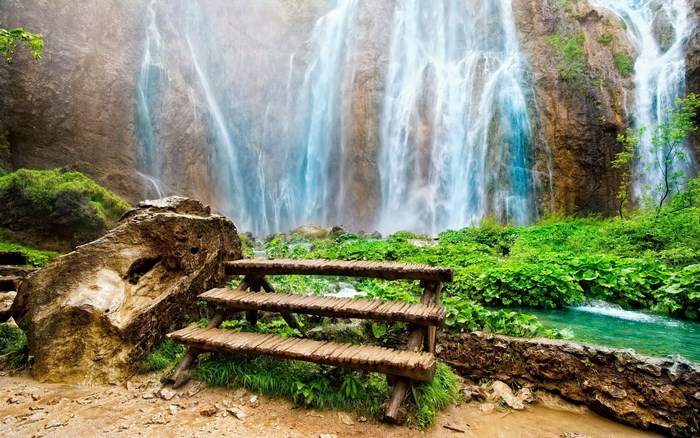 Waterfall with Wooden Bench and Rocks