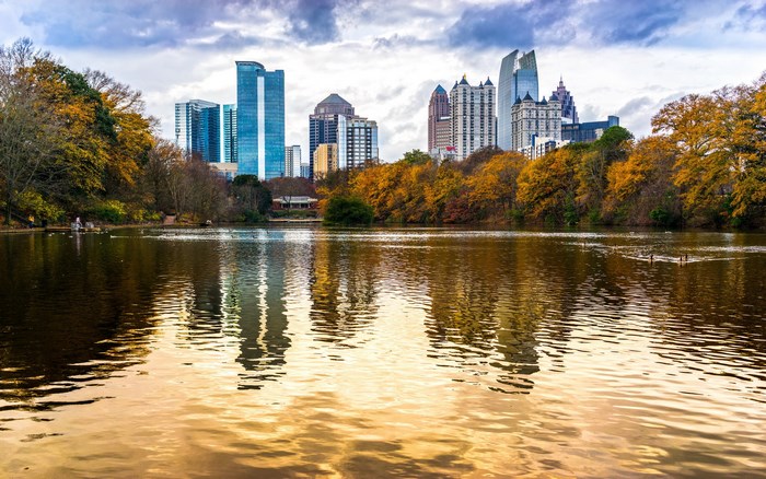 Atlanta skyline reflected in a lake during autumn