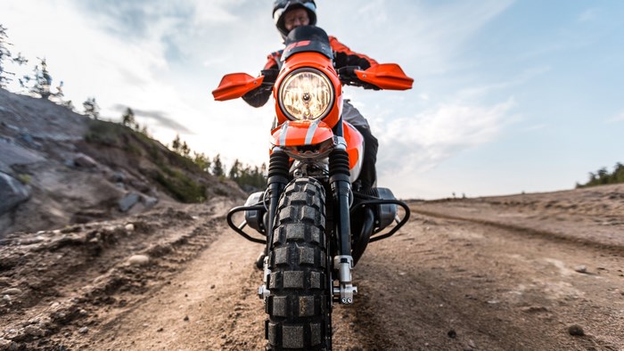 Motorcyclist on a dirt road