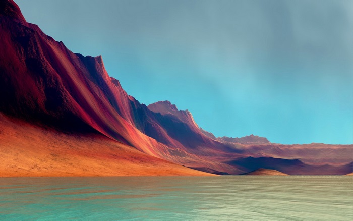 Red mountains by the water under a blue sky