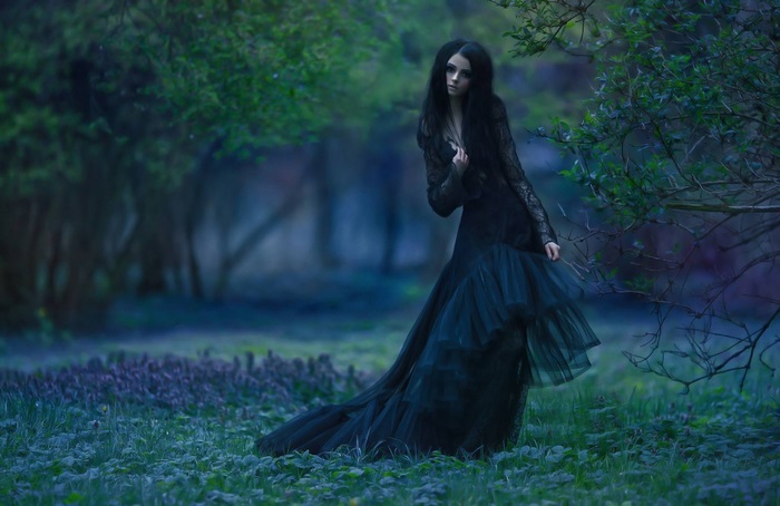 Mysterious Woman in Black Dress in Enchanted Forest