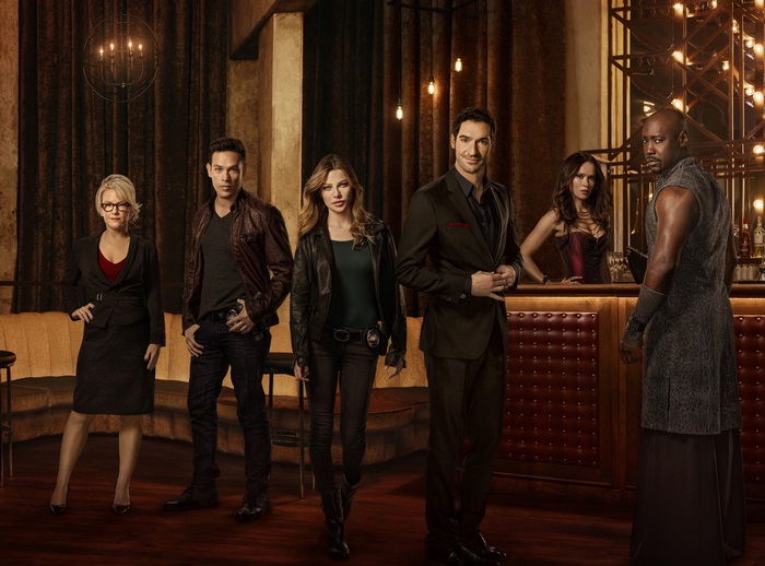 Lucifer cast posing in a bar