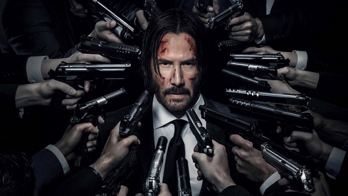 John Wick surrounded by guns