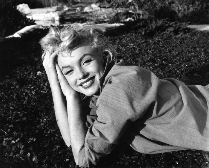 Marilyn Monroe lying on bushes