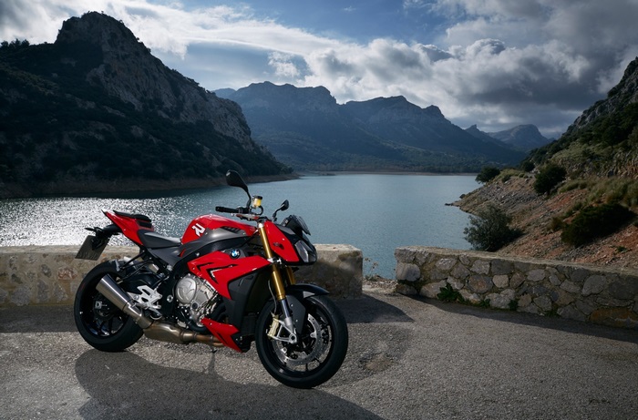 Red BMW S1000R motorcycle by a lake