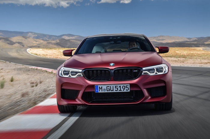 Red BMW M5 F90 on a Racetrack