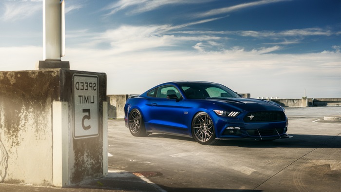 Blue Ford Mustang GT parked on rooftop