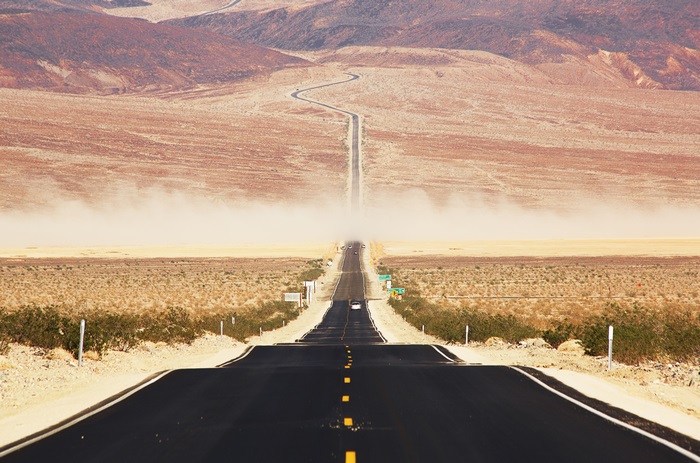 Desert highway with dust storm in California